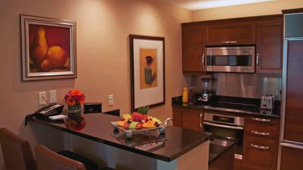 Signature Suites One Bedroom Kitchenette With Fruit And Flowers .image .1488.836.high  624x351 