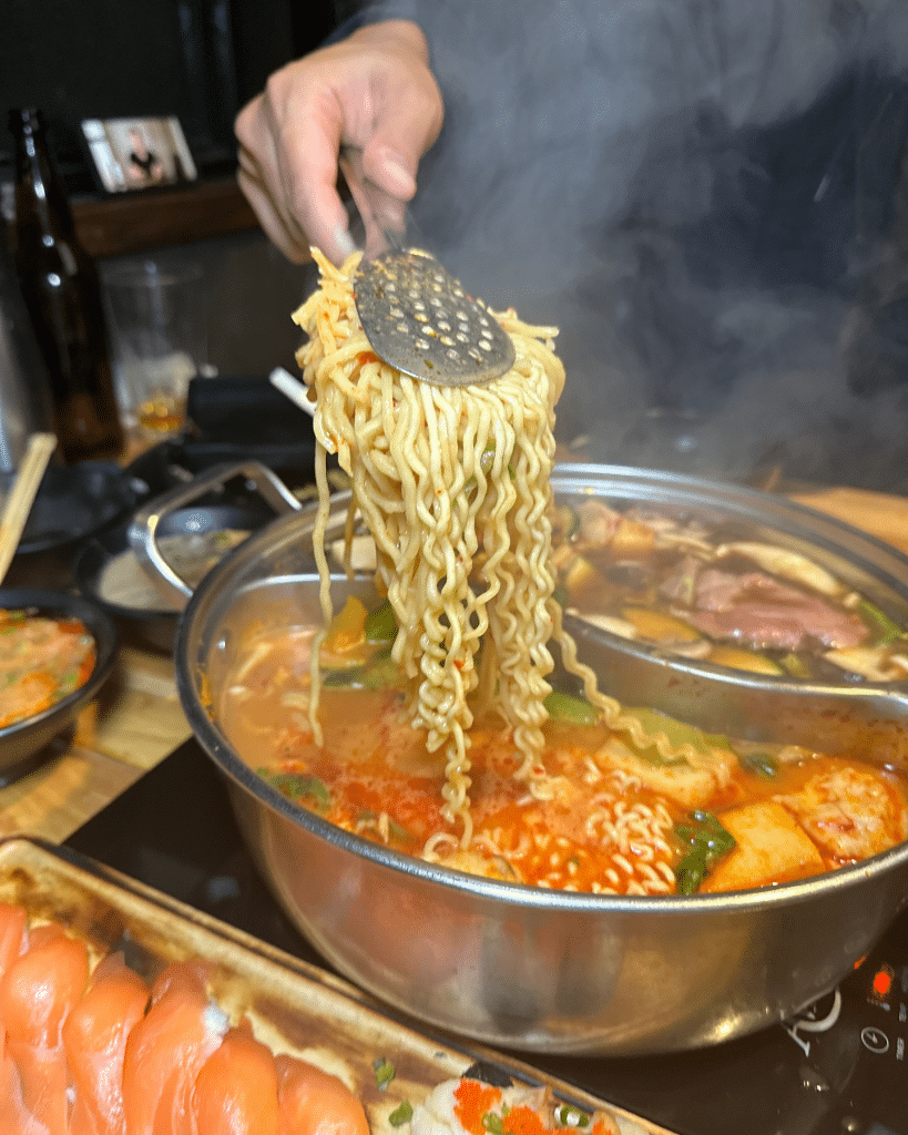 Pot with broth and noodles at Nabe AYCE Hot Pot in Las Vegas