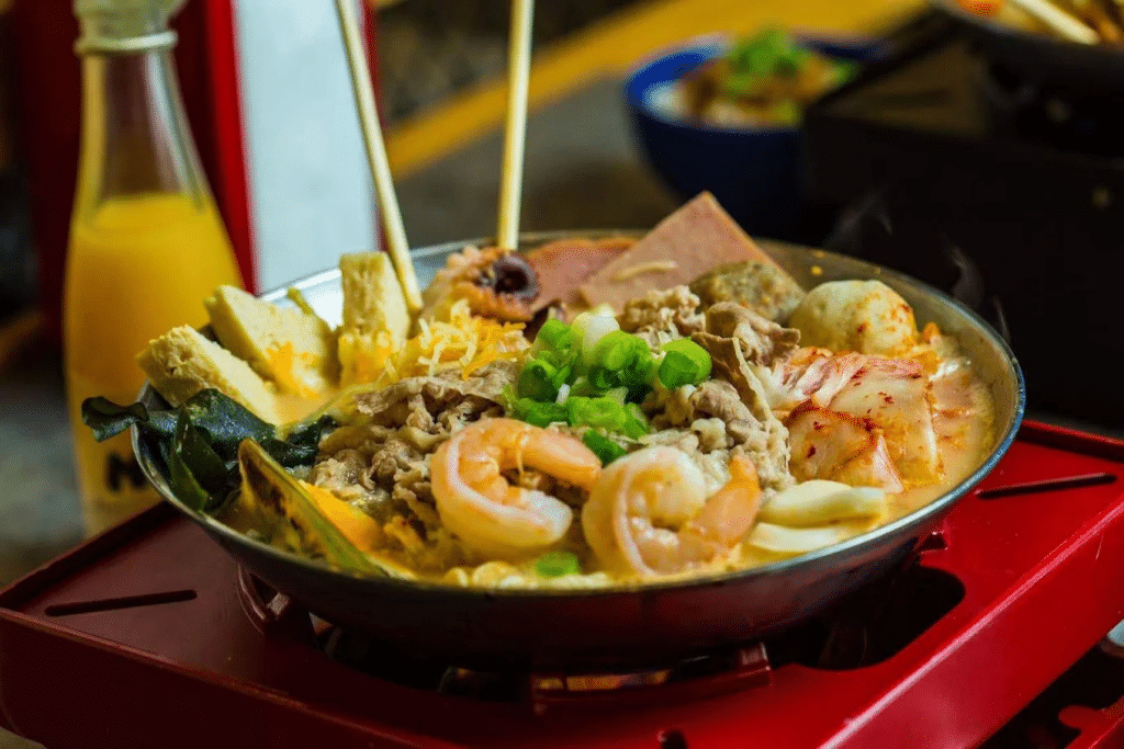Soup pot filled with vegetables, noodles, and shrimp at Alleyway Hot Pot in Las Vegas