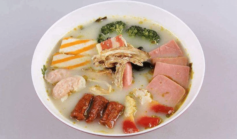 A selection of meats and vegetables in broth from The Best Hot Pot in Las Vegas.