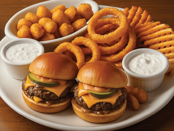 Photo of two burgers, tater tots, onion rings, and fries from 90 NINETY Bar + Grill at Suncoast Hotel and Casino